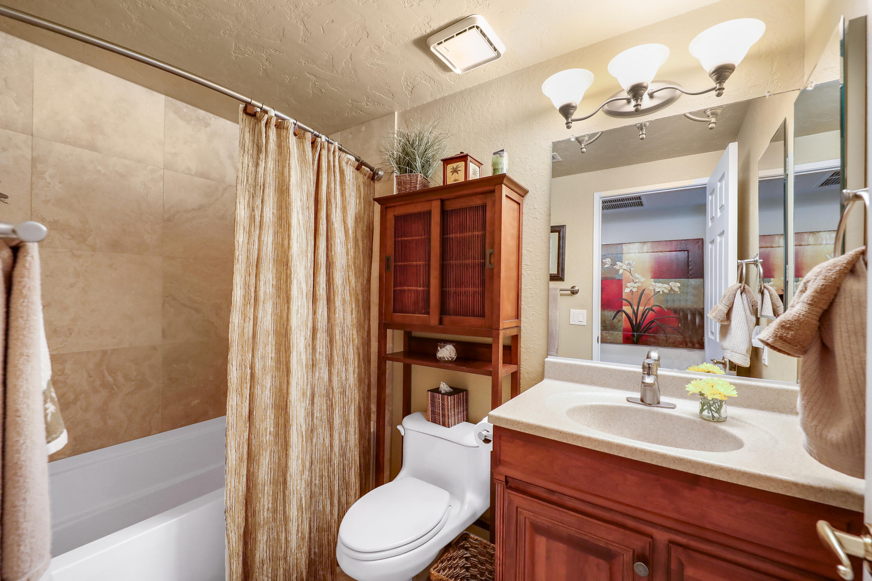 71601 Halgar Road Rancho Mirage, CA 92270 - Photo 21 of 35 a bathroom with a sink a toilet a mirror and shower
