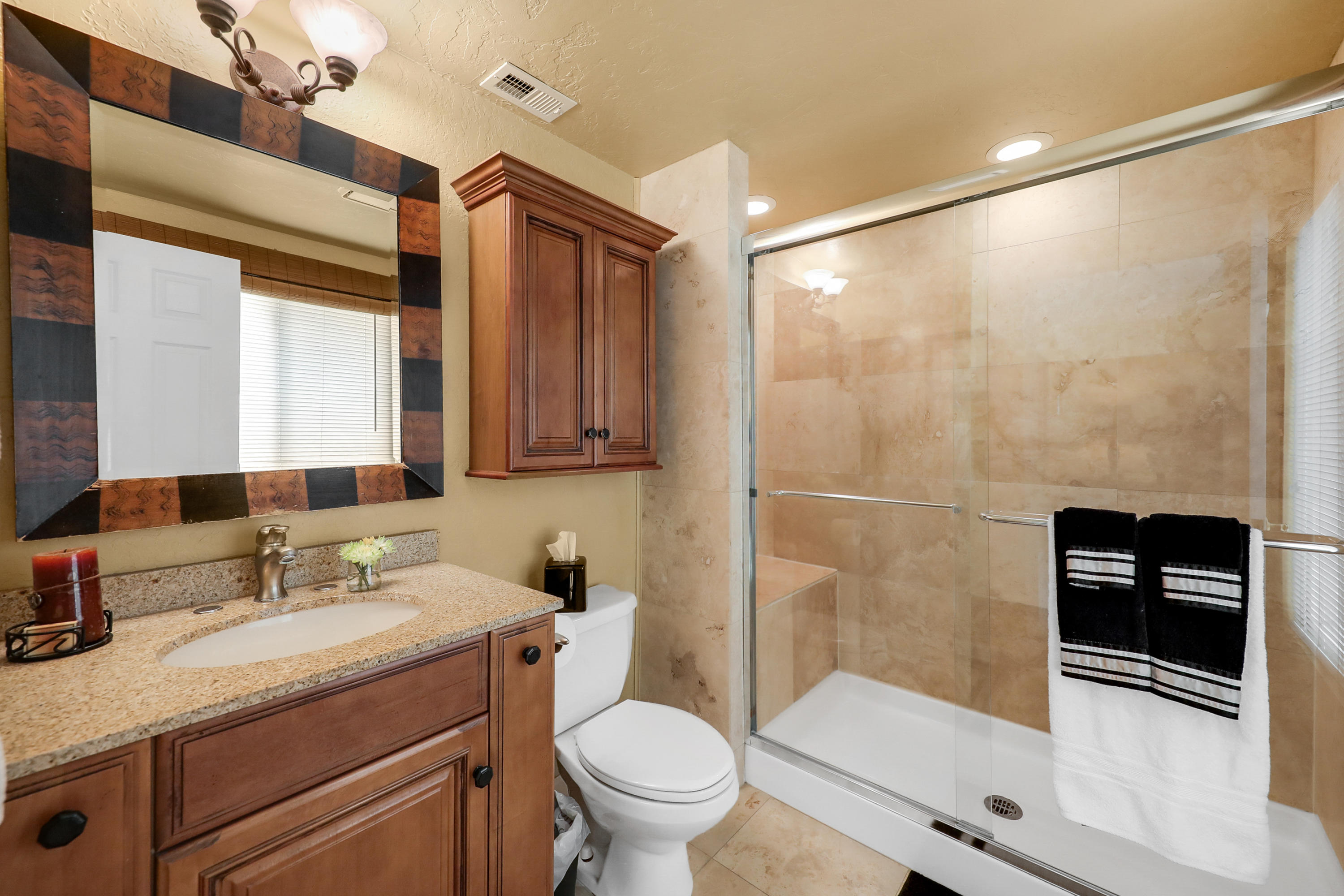 71601 Halgar Road Rancho Mirage, CA 92270 - Photo 26 of 35 a bathroom with a granite countertop sink toilet and shower