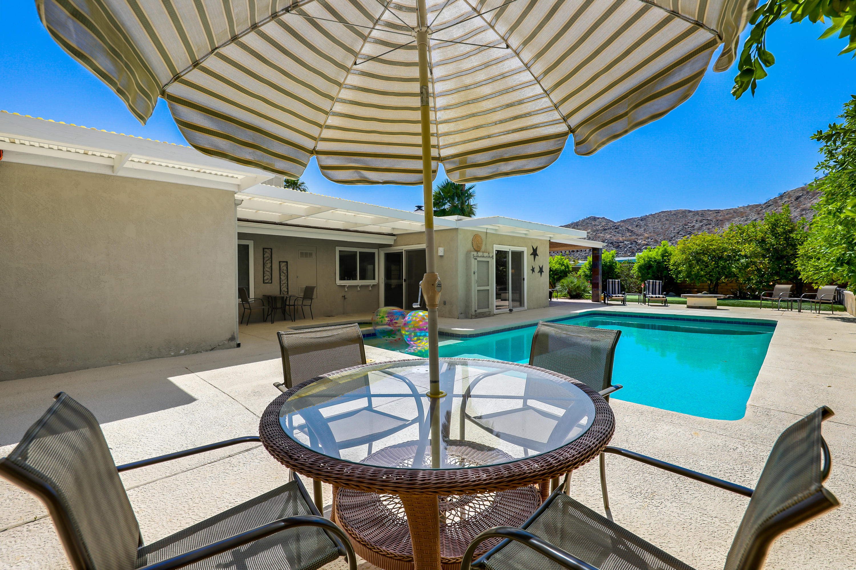 71601 Halgar Road Rancho Mirage, CA 92270 - Photo 28 of 35 a view of a house with a backyard and a patio