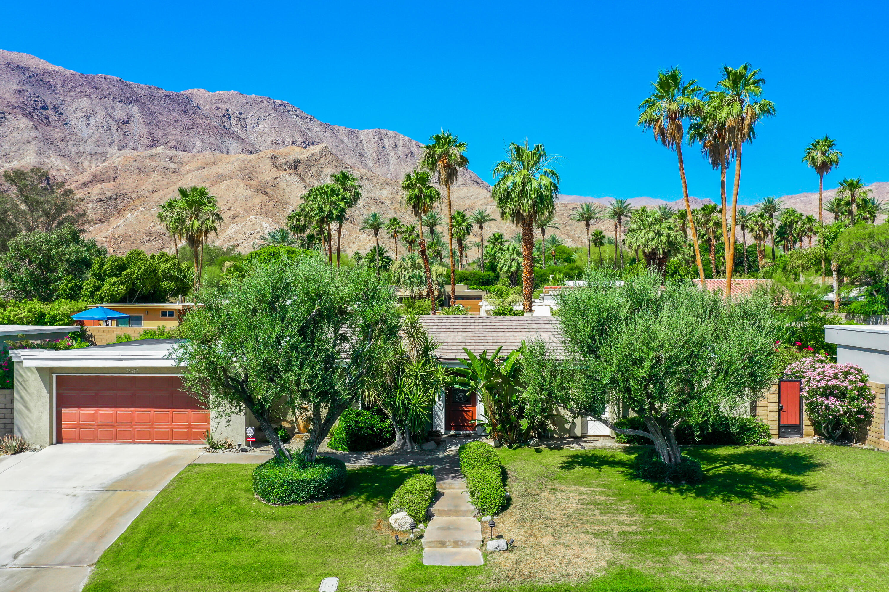 71601 Halgar Road Rancho Mirage, CA 92270 - Photo 3 of 35 a view of a garden with a mountain