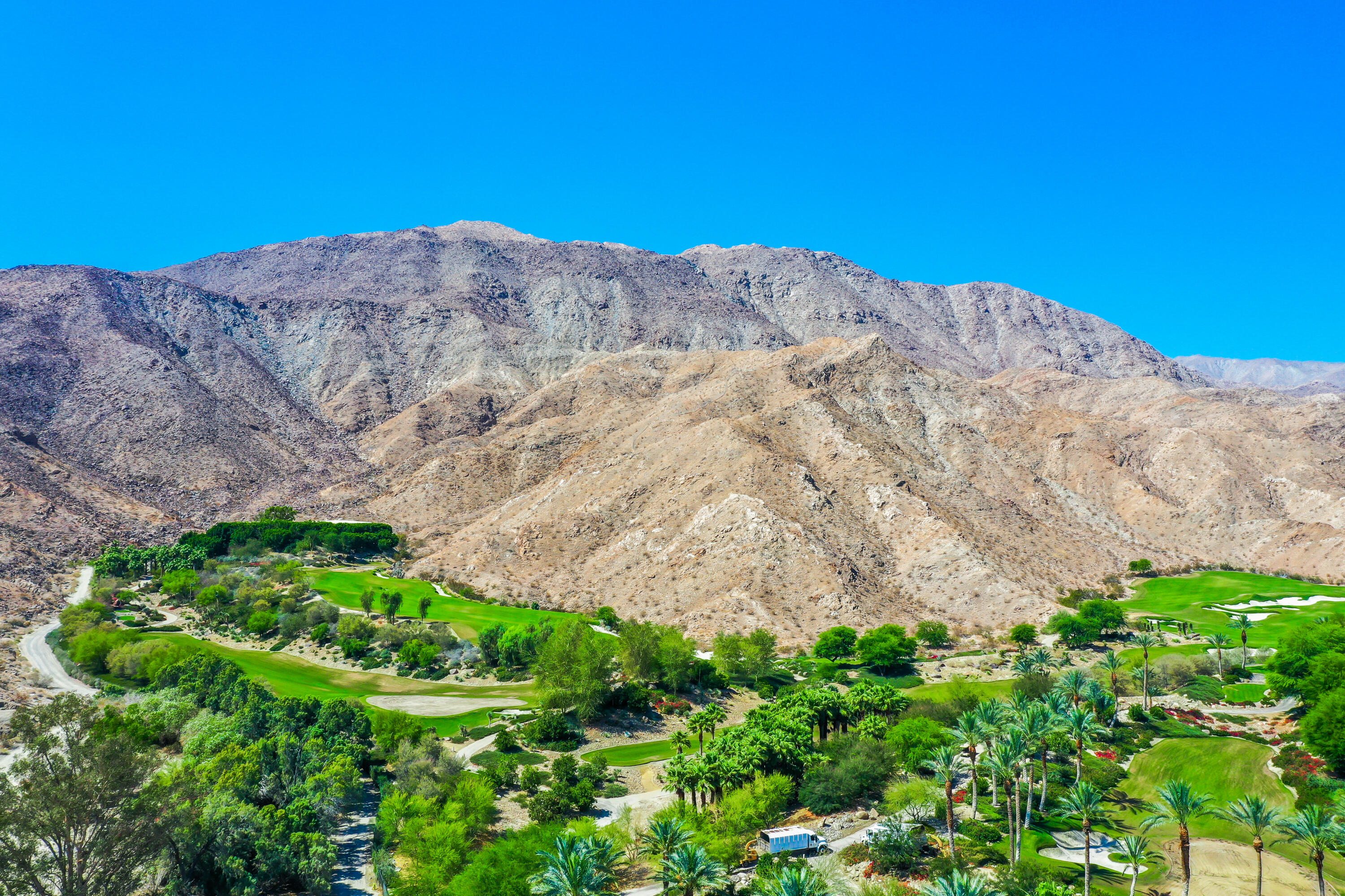 71601 Halgar Road Rancho Mirage, CA 92270 - Photo 4 of 35 a view of a mountain in the distance in a garden