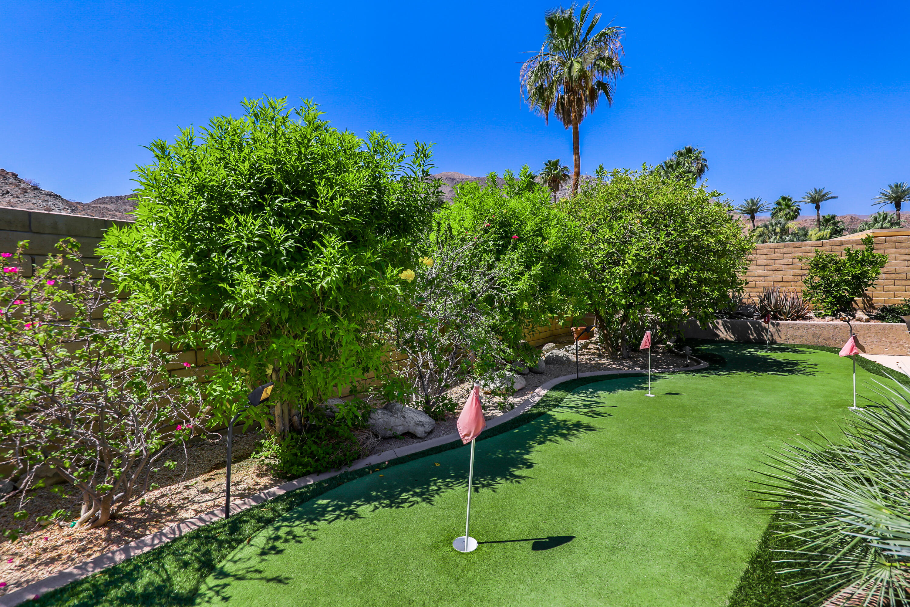 71601 Halgar Road Rancho Mirage, CA 92270 - Photo 33 of 35 a view of a table and chairs in the garden