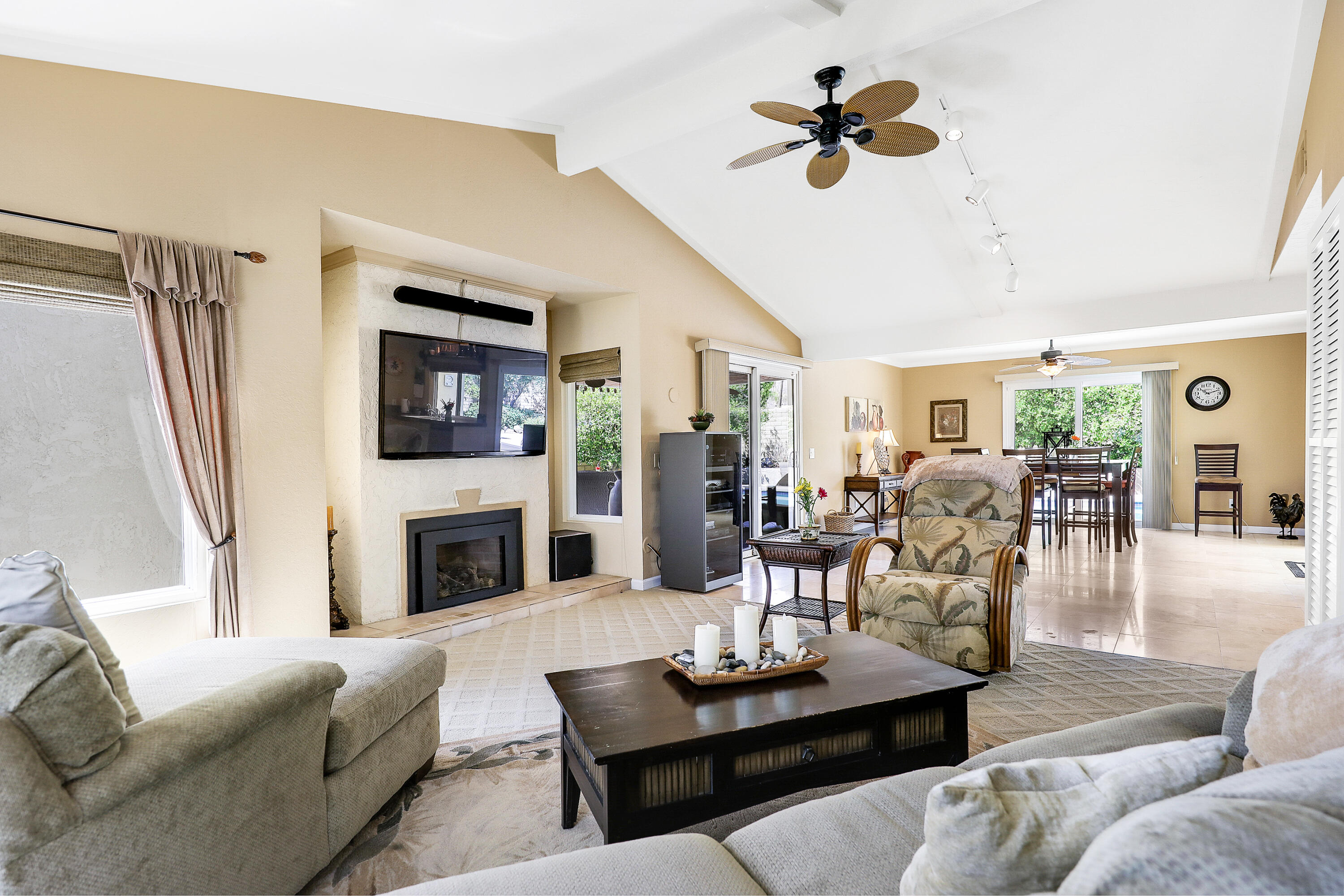 71601 Halgar Road Rancho Mirage, CA 92270 - Photo 9 of 35 a living room with furniture fireplace and a flat screen tv
