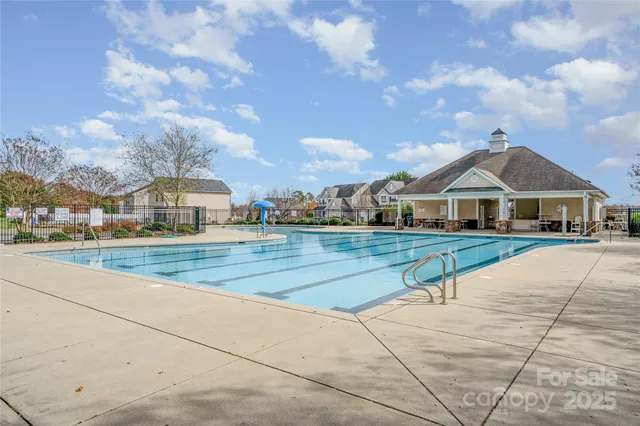a view of house with yard and entertaining space