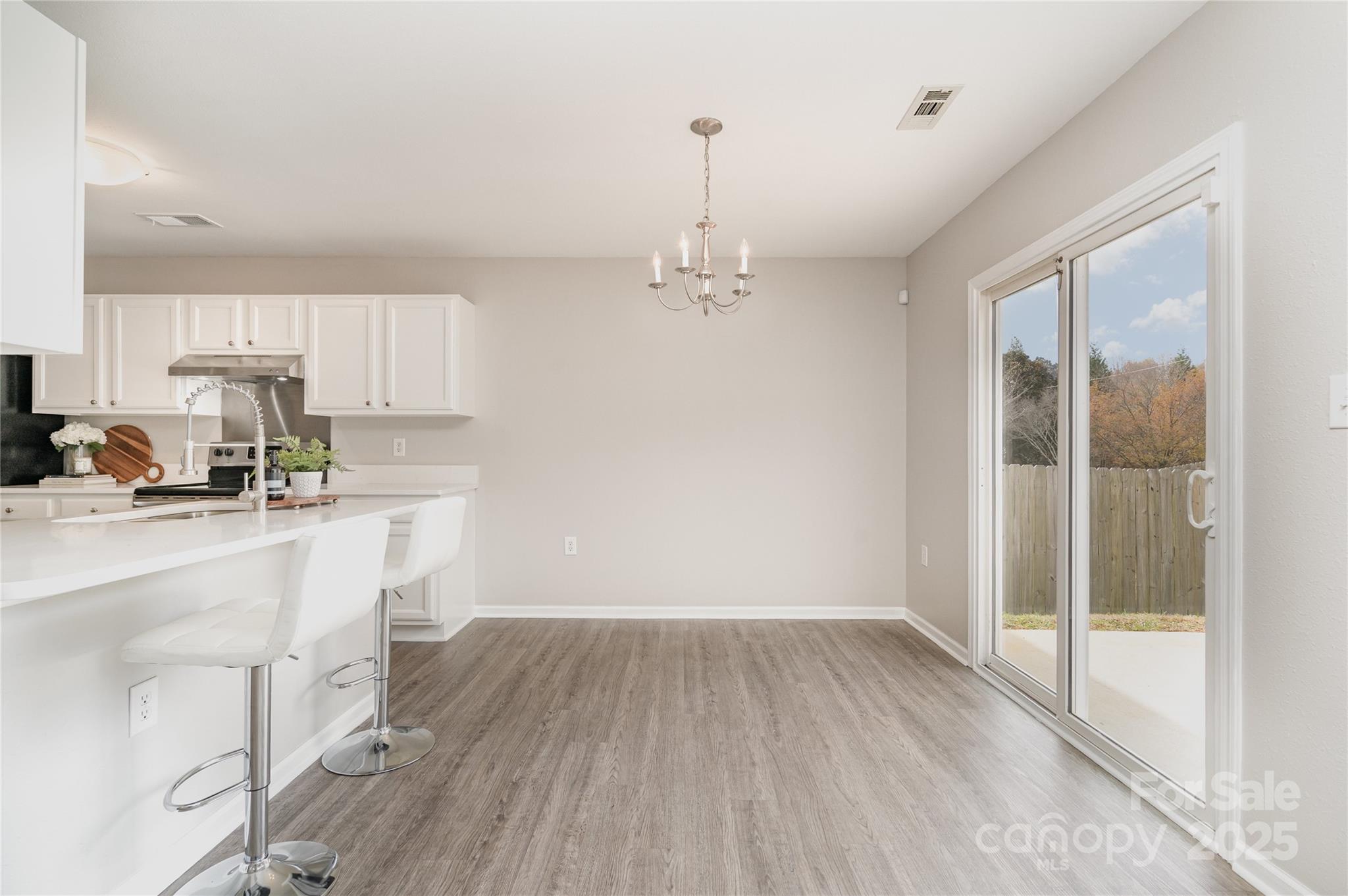 2919 Heather Ridge Road Dallas, NC 28034 - Photo 5 of 24 a view of a kitchen with wooden floor and a window
