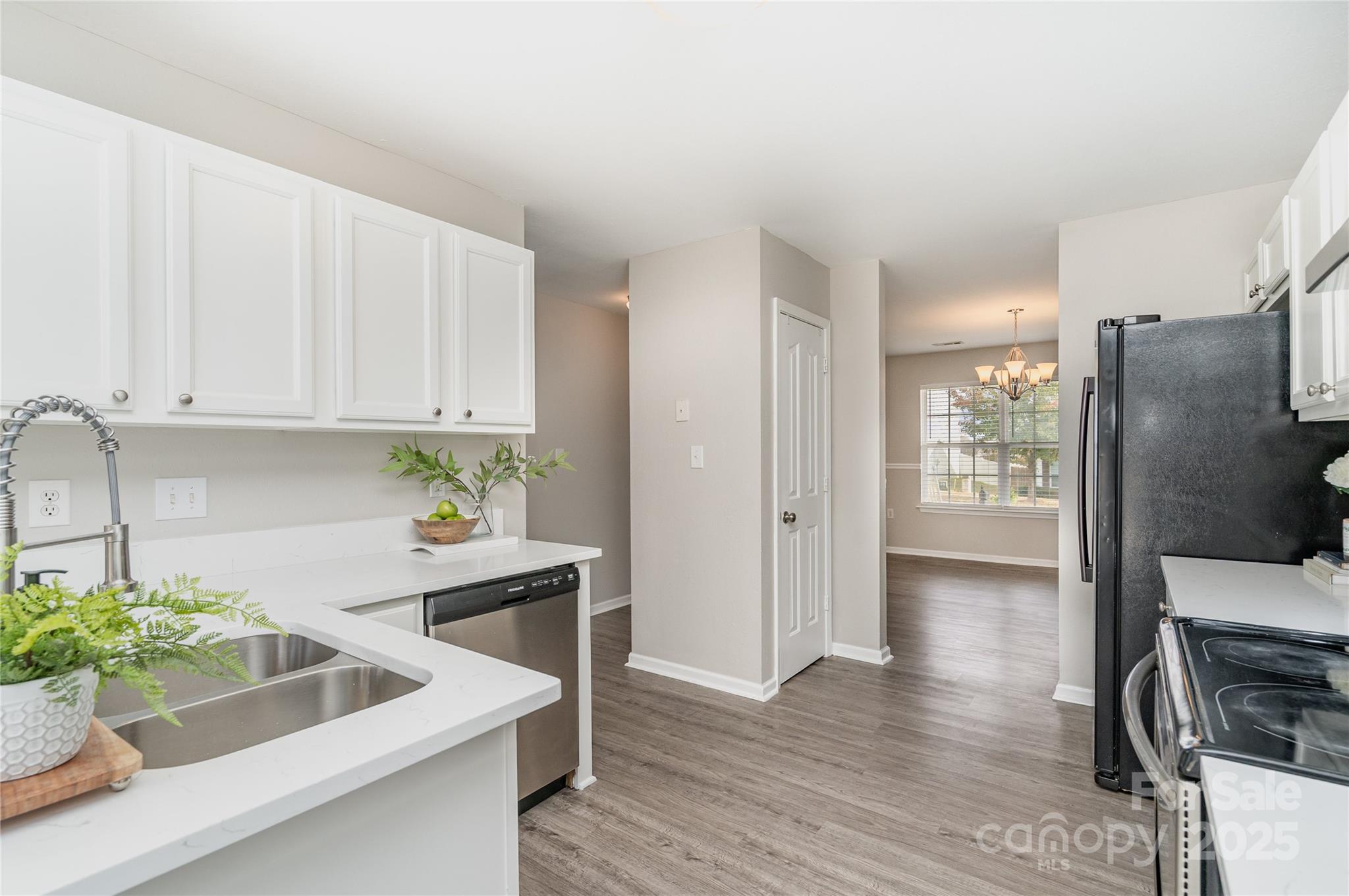 2919 Heather Ridge Road Dallas, NC 28034 - Photo 6 of 24 a kitchen with a sink and refrigerator