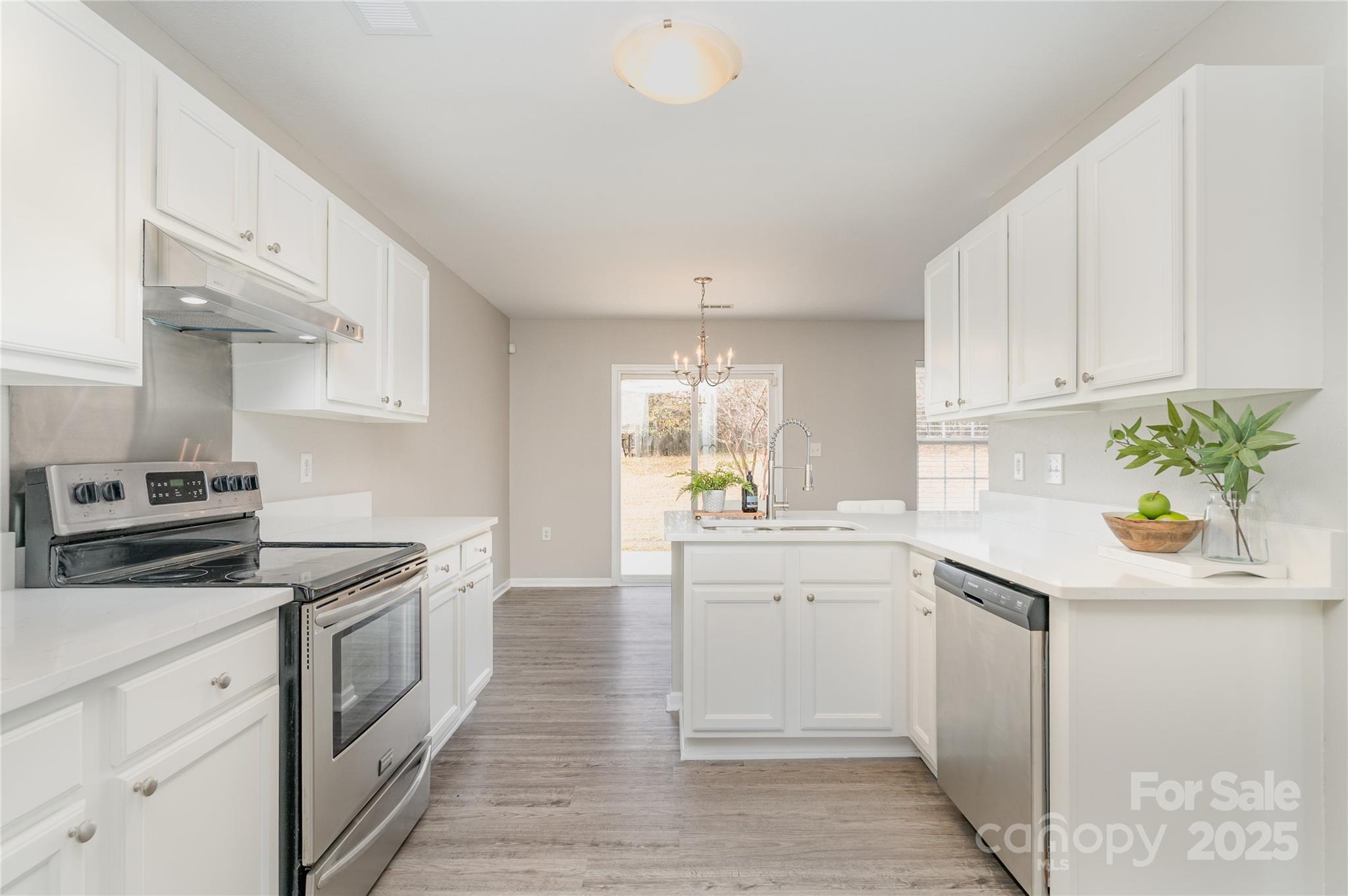 2919 Heather Ridge Road Dallas, NC 28034 - Photo 7 of 24 a kitchen with a sink stove and cabinets