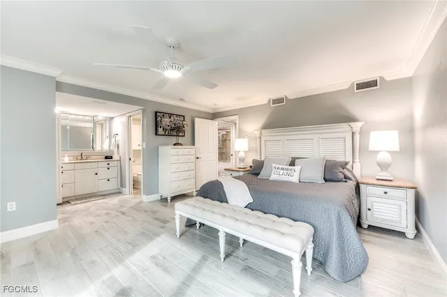 a living room with furniture and view of kitchen