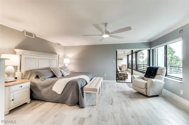 a bed room with bed and windows