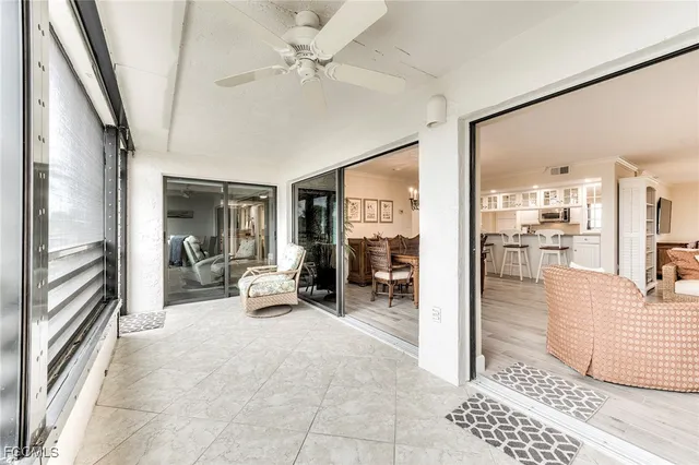a view of a livingroom with furniture and a ceiling fan