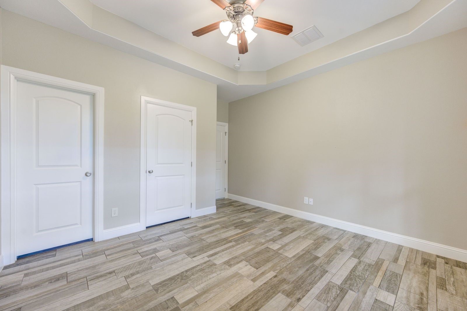 21038 Angus Drive Cleveland, TX 77328 - Photo 35 of 49 a view of an empty room with wooden floor