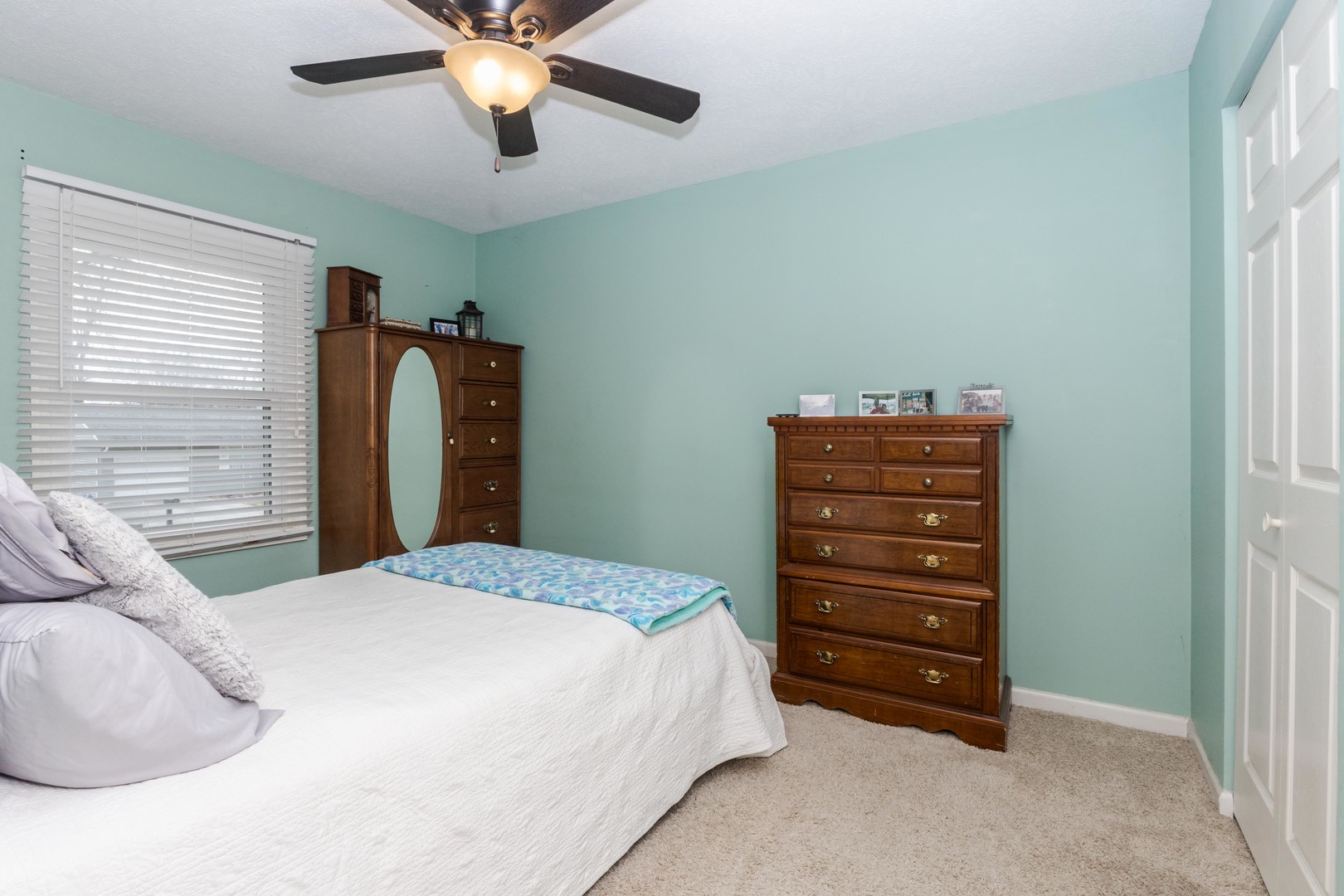 1400 Kingsridge Drive Normal, IL 61761 - Photo 14 of 31 a bedroom with a bed and a chandelier