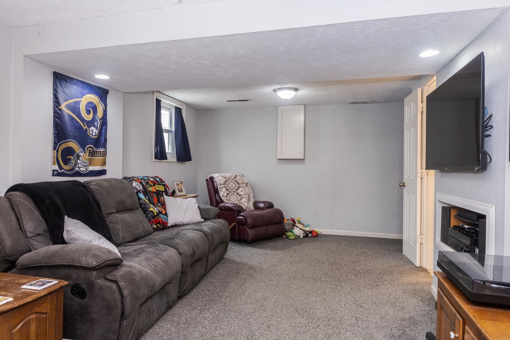 1400 Kingsridge Drive Normal, IL 61761 - Photo 19 of 31 a living room with furniture and a flat screen tv