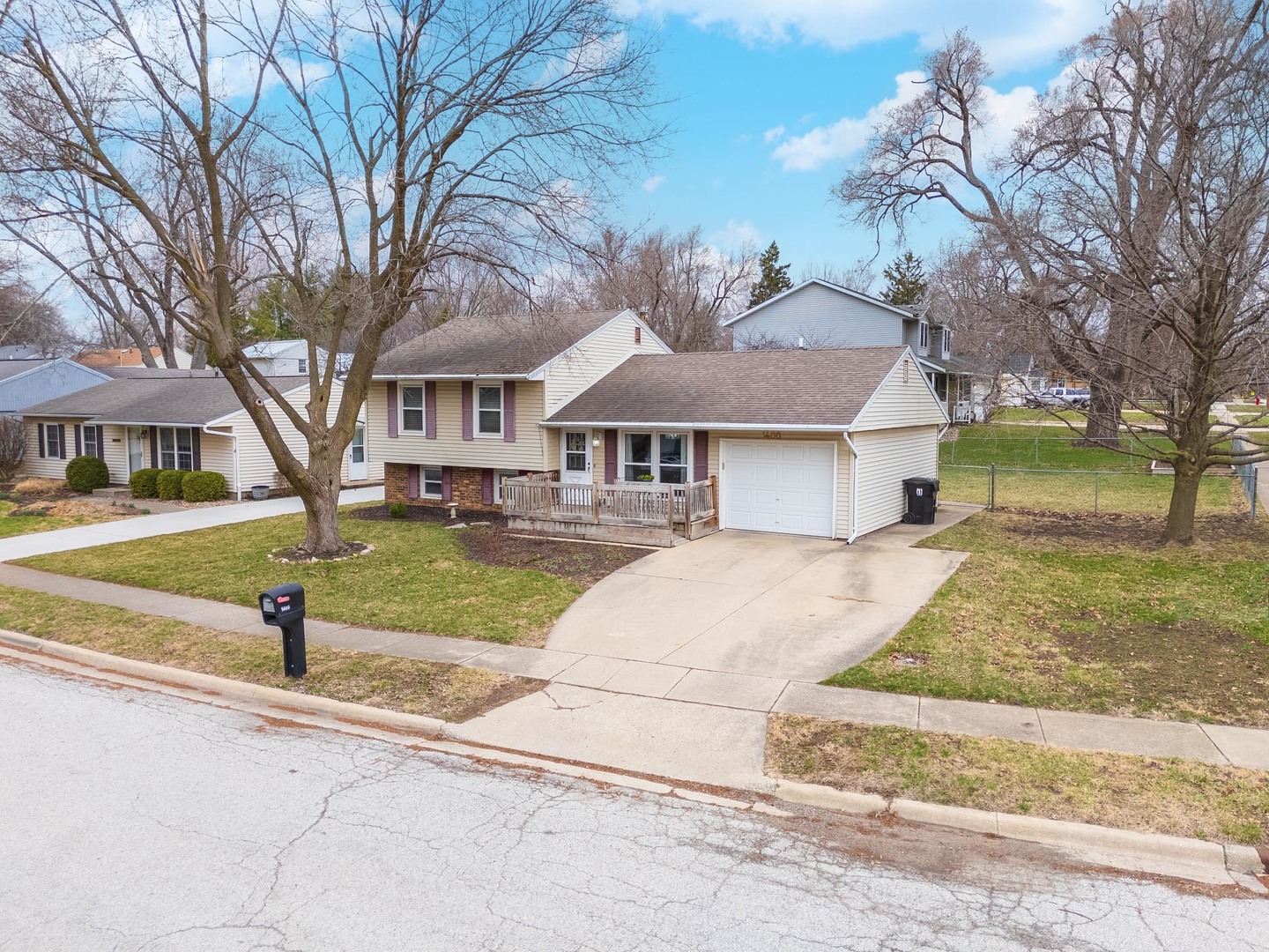 1400 Kingsridge Drive Normal, IL 61761 - Photo 2 of 31 a front view of a house with a yard