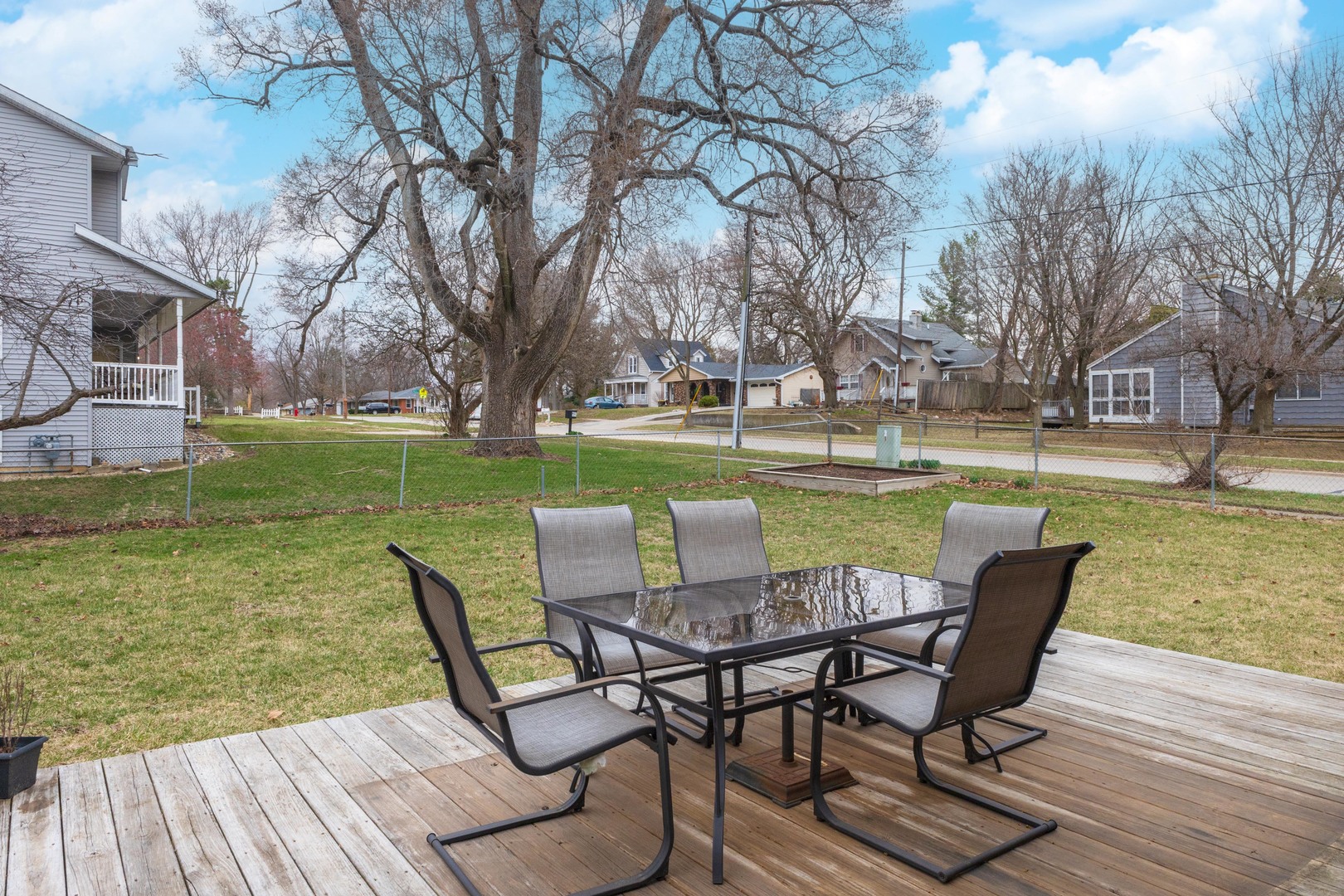 1400 Kingsridge Drive Normal, IL 61761 - Photo 24 of 31 a view of a chairs and table on deck with wooden floor and fence