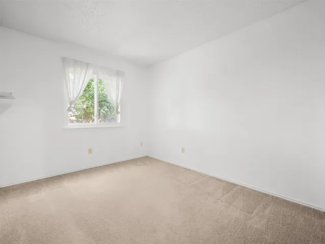 an aerial view of a house with a garden
