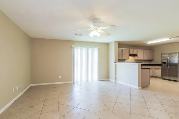 a kitchen with a stove a sink and a refrigerator