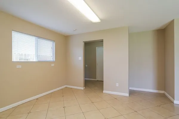 a view of an empty room with a window
