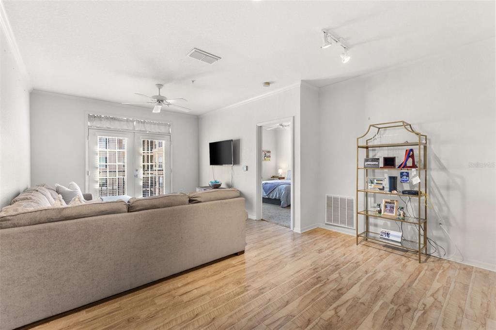 4221 West Spruce Street, Unit 1326 Tampa, FL 33607 - Photo 12 of 45 a living room with furniture and a flat screen tv
