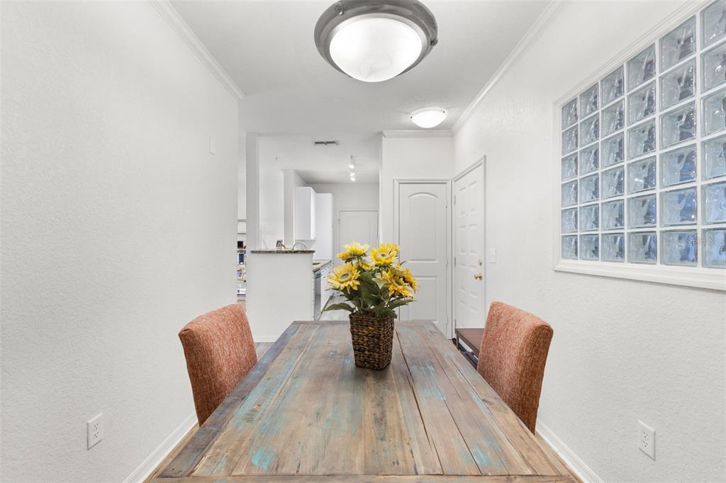 4221 West Spruce Street, Unit 1326 Tampa, FL 33607 - Photo 18 of 45 a view of kitchen with furniture and a potted plant