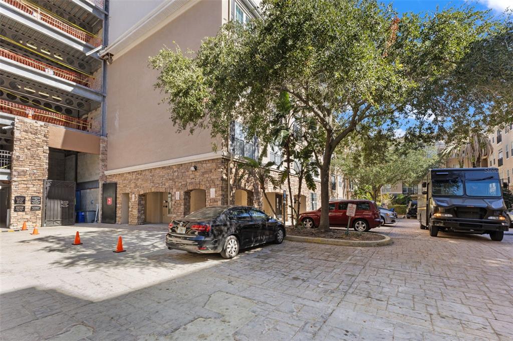 4221 West Spruce Street, Unit 1326 Tampa, FL 33607 - Photo 2 of 45 a view of a cars parked in front of a building