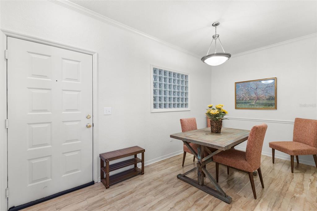 4221 West Spruce Street, Unit 1326 Tampa, FL 33607 - Photo 21 of 45 a view of a dining room with furniture and wooden floor