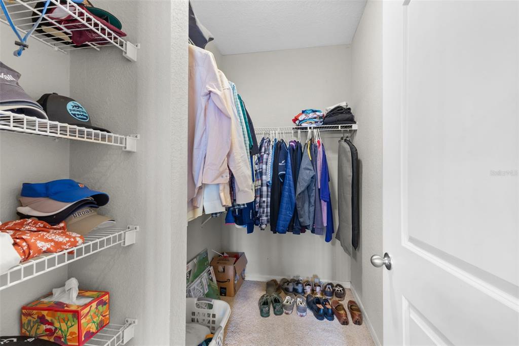 4221 West Spruce Street, Unit 1326 Tampa, FL 33607 - Photo 28 of 45 a view of walk in closet with clothes and shoes