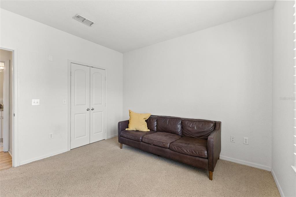 4221 West Spruce Street, Unit 1326 Tampa, FL 33607 - Photo 30 of 45 a living room with a couch
