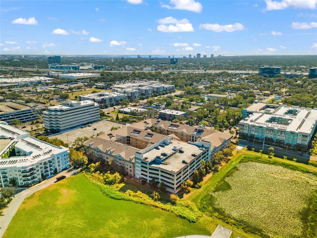 4221 West Spruce Street, Unit 1326 Tampa, FL 33607 - Photo 39 of 45 an aerial view of residential houses with outdoor space