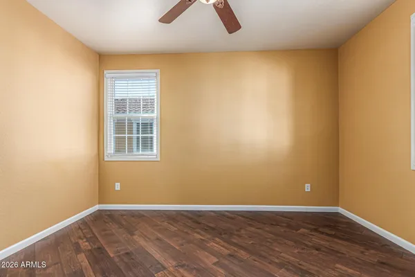 a bathroom with a sink a mirror a vanity and shower