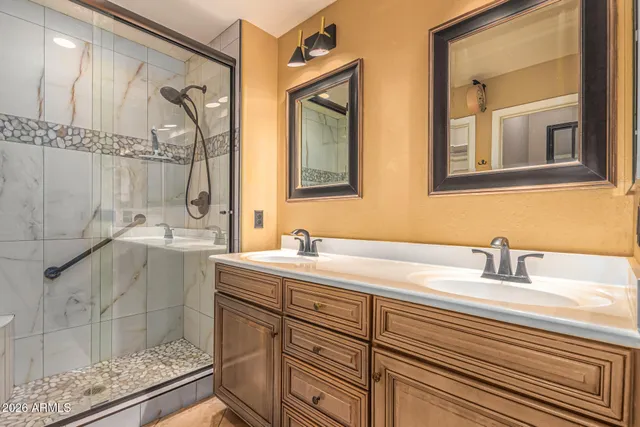 a bathroom with a glass shower door