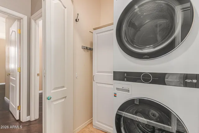 a view of a house with wooden fence