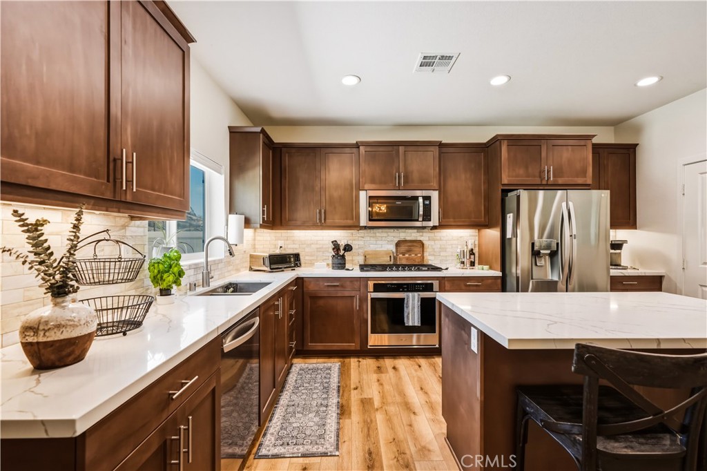 29853 White Ridge Road Winchester, CA 92596 - Photo 10 of 61 Island kitchen with custom back splash and walk in panty