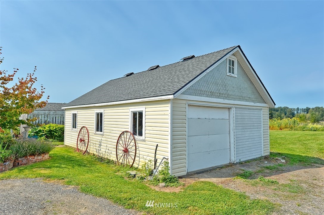 3668 Bay Road Ferndale, WA 98248 - Photo 18 of 40 a front view of a house with a yard
