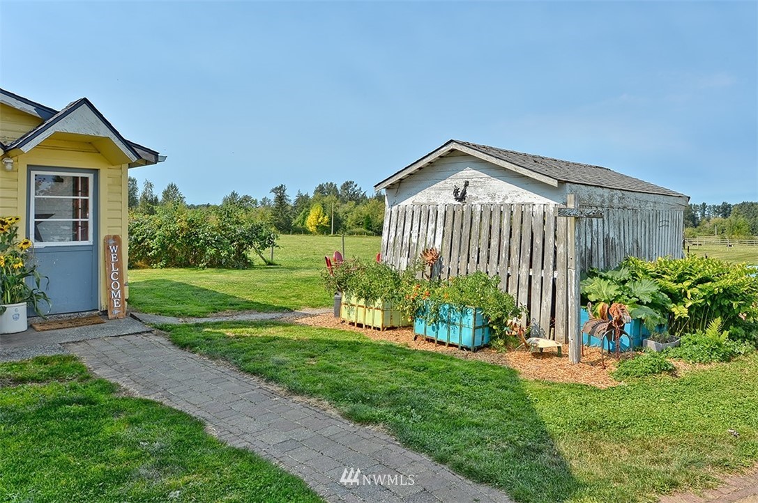 3668 Bay Road Ferndale, WA 98248 - Photo 22 of 40 a front view of a house with a yard