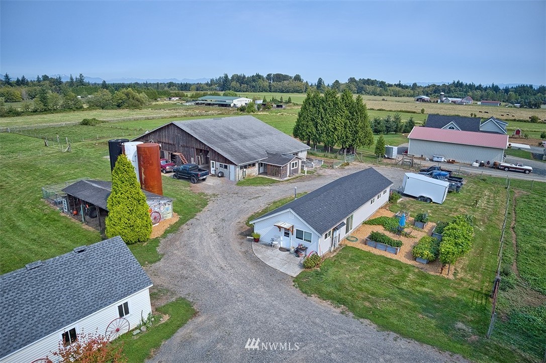 3668 Bay Road Ferndale, WA 98248 - Photo 29 of 40 an aerial view of a house with outdoor space and lake view
