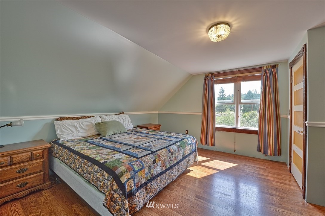 3668 Bay Road Ferndale, WA 98248 - Photo 9 of 40 a bedroom with a bed and a window