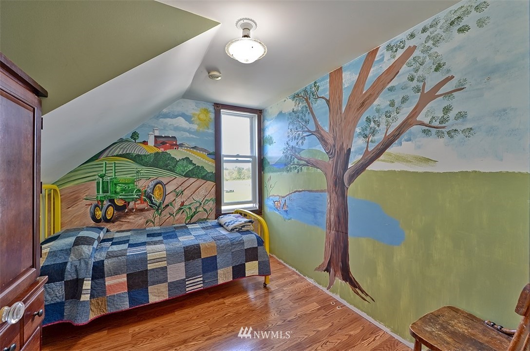 3668 Bay Road Ferndale, WA 98248 - Photo 10 of 40 a bedroom with furniture and a wooden floor