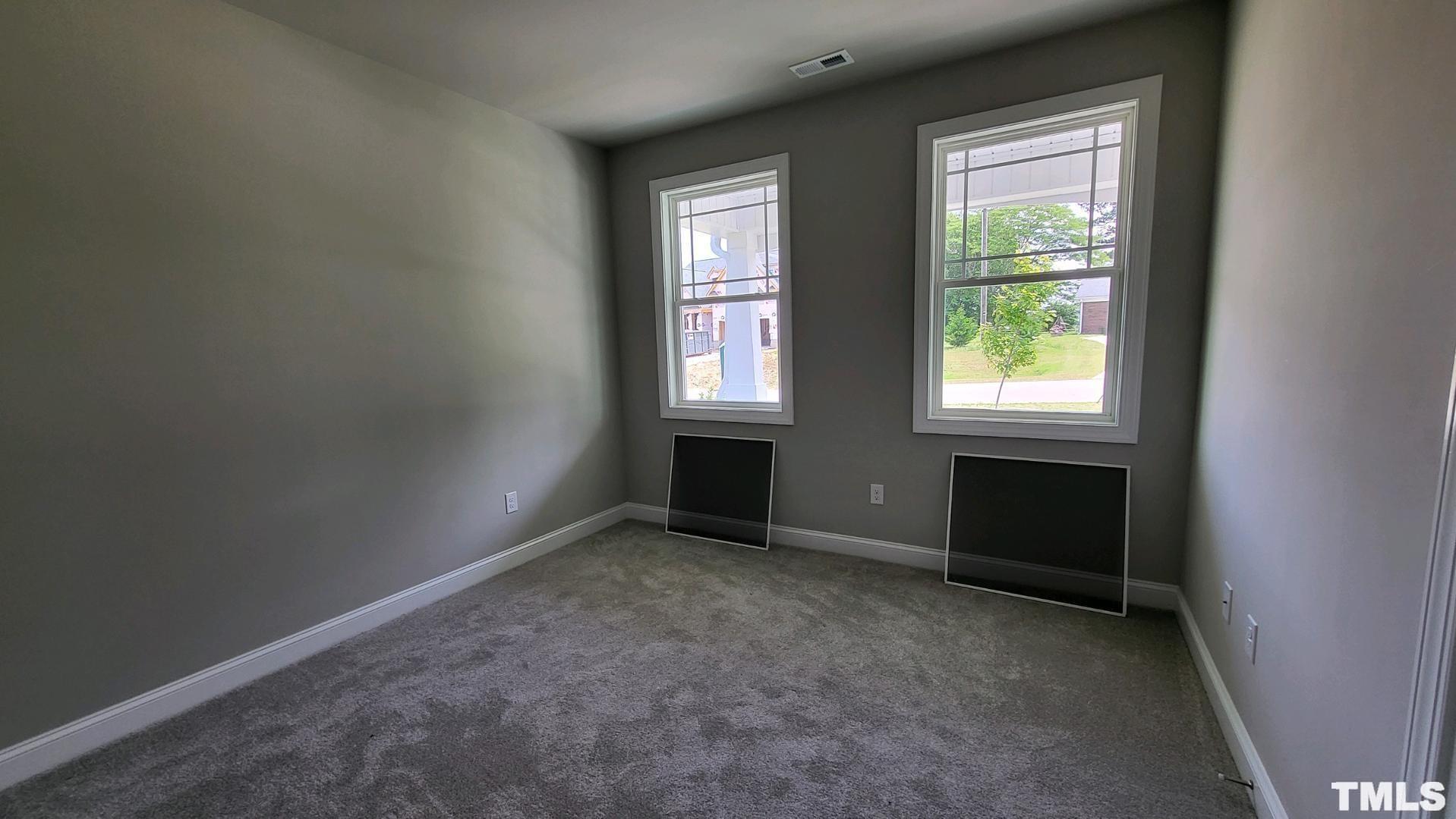 33 Crystal Spgs Way Benson, NC 27504 - Photo 12 of 15 an empty room with windows