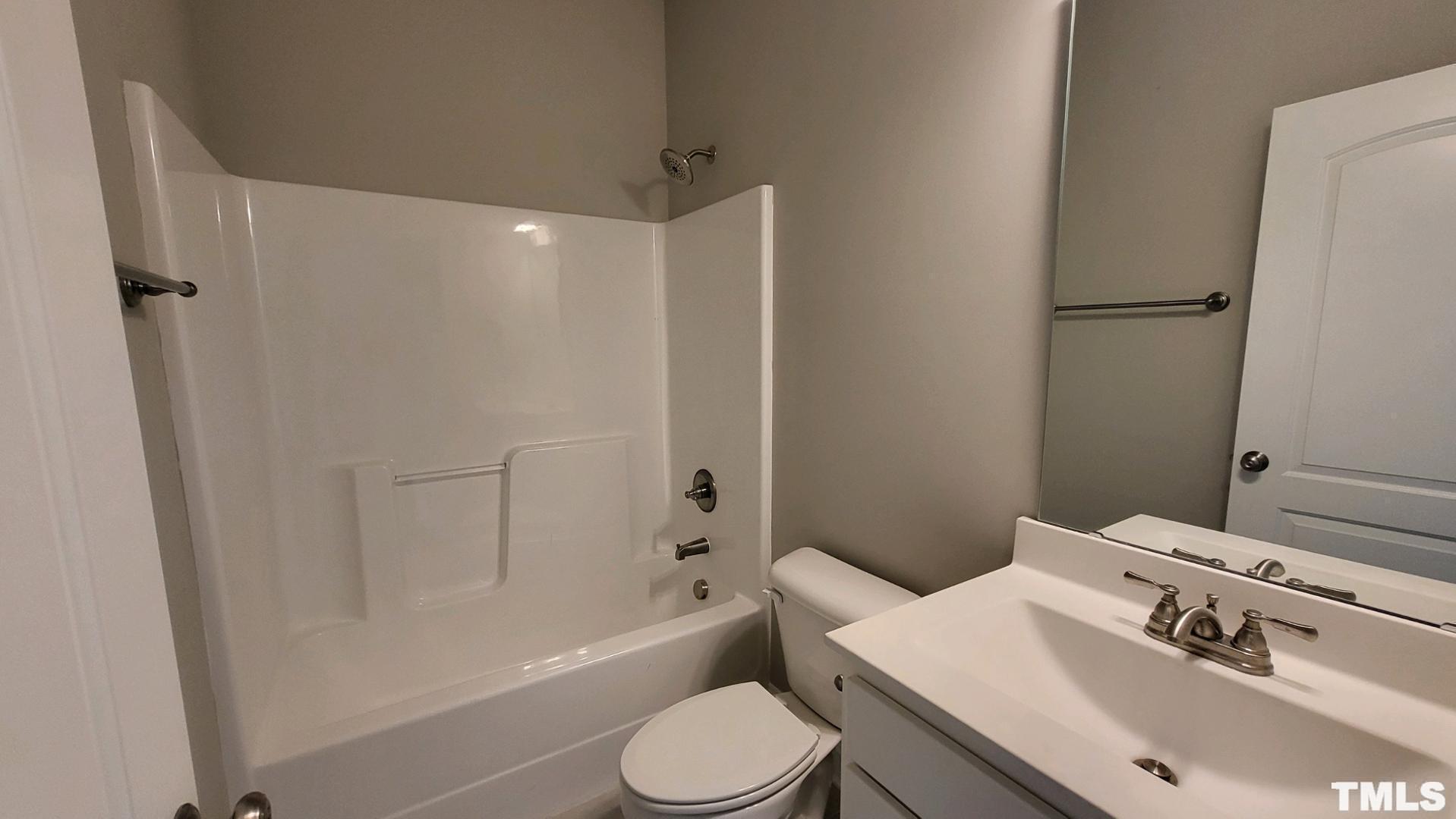 33 Crystal Spgs Way Benson, NC 27504 - Photo 14 of 15 a bathroom with a sink toilet and shower