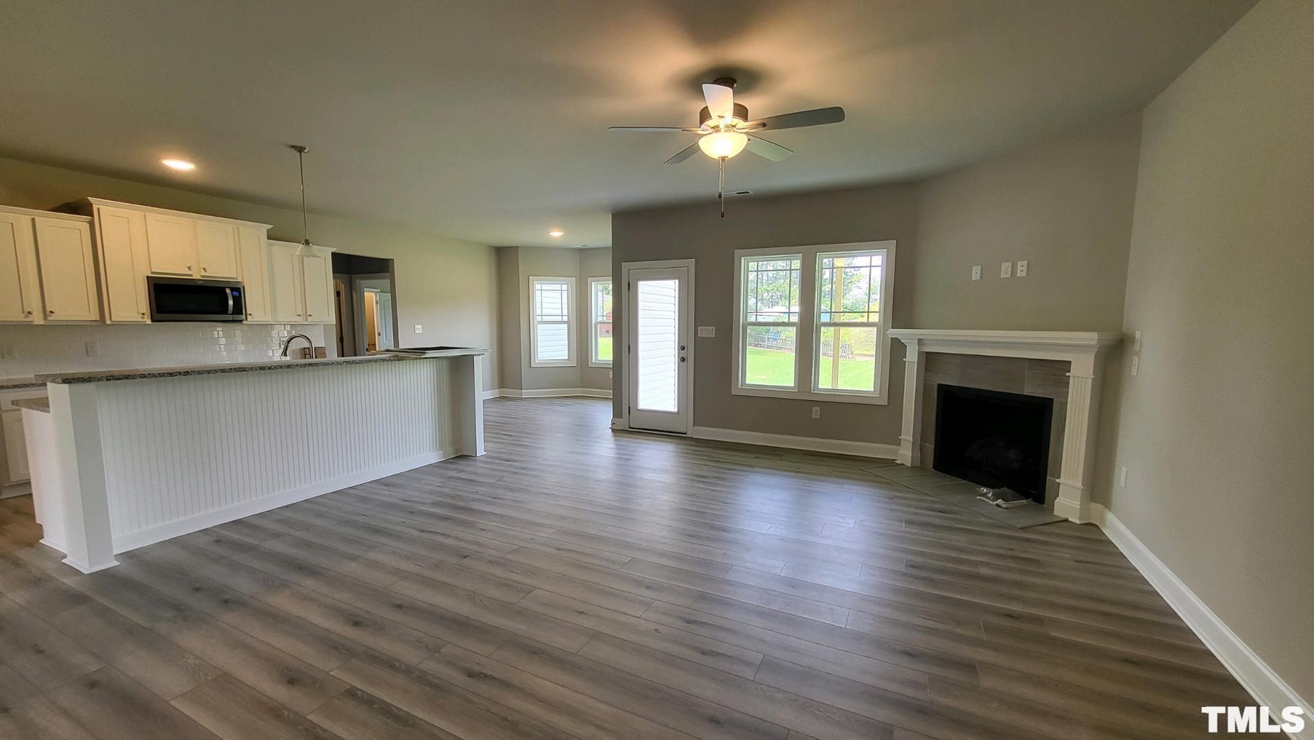 33 Crystal Spgs Way Benson, NC 27504 - Photo 3 of 15 a view of a kitchen with a sink a microwave and a refrigerator