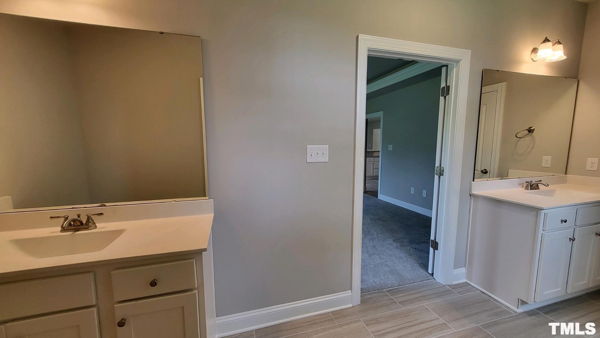 33 Crystal Spgs Way Benson, NC 27504 - Photo 8 of 15 a bathroom with a sink and a mirror