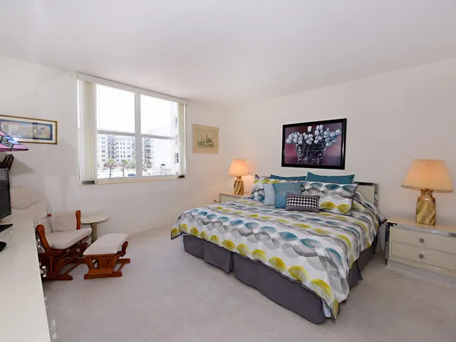 a bedroom with bed and a window