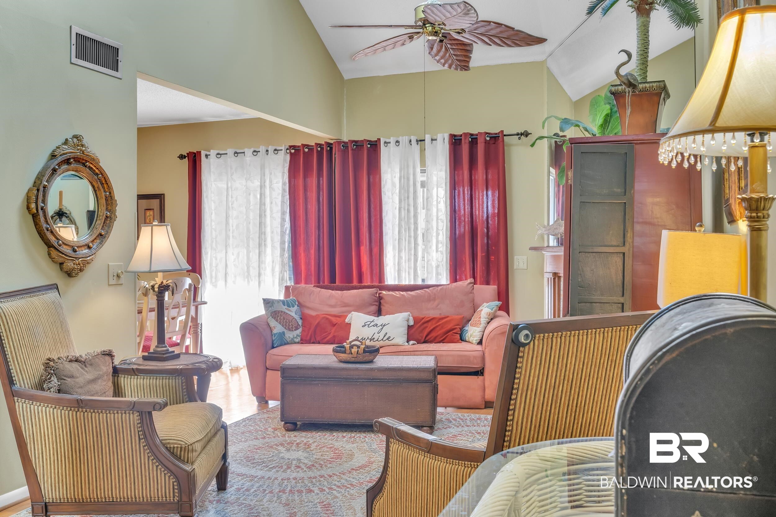 3256 Loop Road, Unit 2 Orange Beach, AL 36561 - Photo 11 of 25 Living area with vaulted ceilings, a ceiling fan, and wood-finish flooring