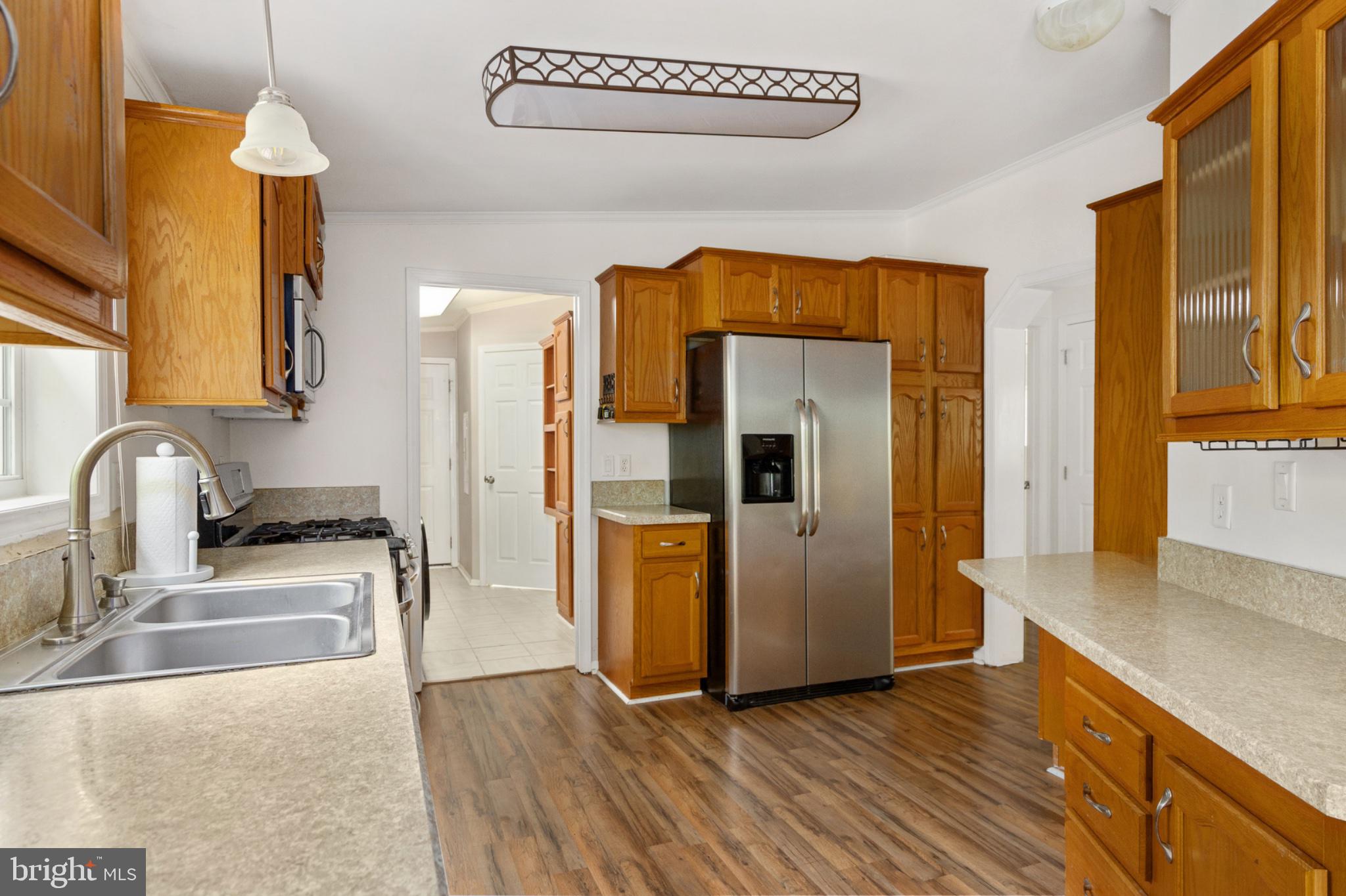2319 Sizer Road Beaverdam, VA 23015 - Photo 30 of 61 a kitchen with stainless steel appliances granite countertop a refrigerator a stove and a sink with wooden floors