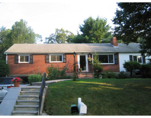 3 Linda Road Andover, MA 01810 - Photo 1 of 10 a front view of a house with a yard and garden
