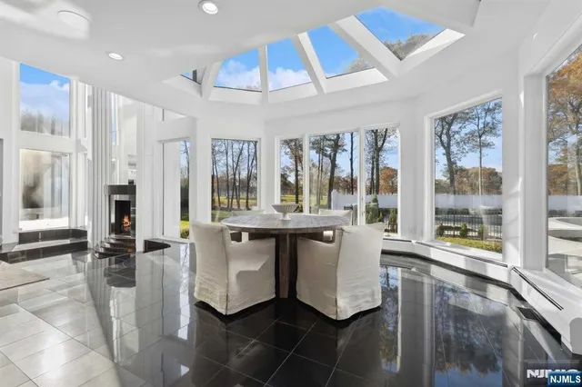 a large white kitchen with a large window