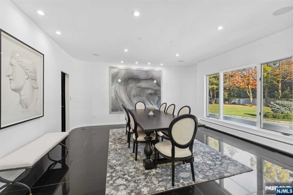 23 Rio Vista Drive Alpine, NJ 07620 - Photo 19 of 47 a view of a dining room with furniture window and wooden floor