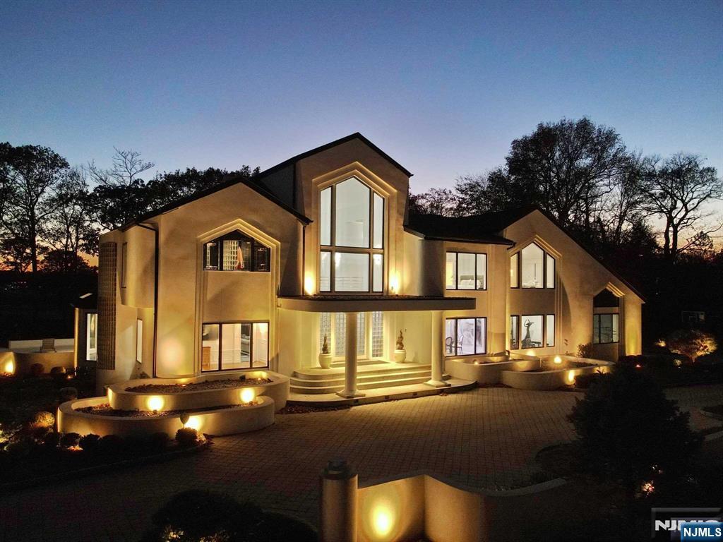 23 Rio Vista Drive Alpine, NJ 07620 - Photo 2 of 47 a front view of a house with a yard