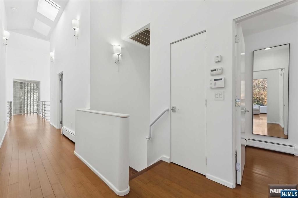 23 Rio Vista Drive Alpine, NJ 07620 - Photo 24 of 47 a view of a hallway with wooden floor